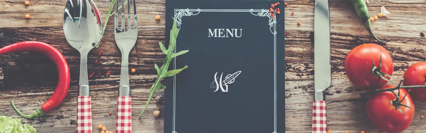 black menu on table between eating utensils